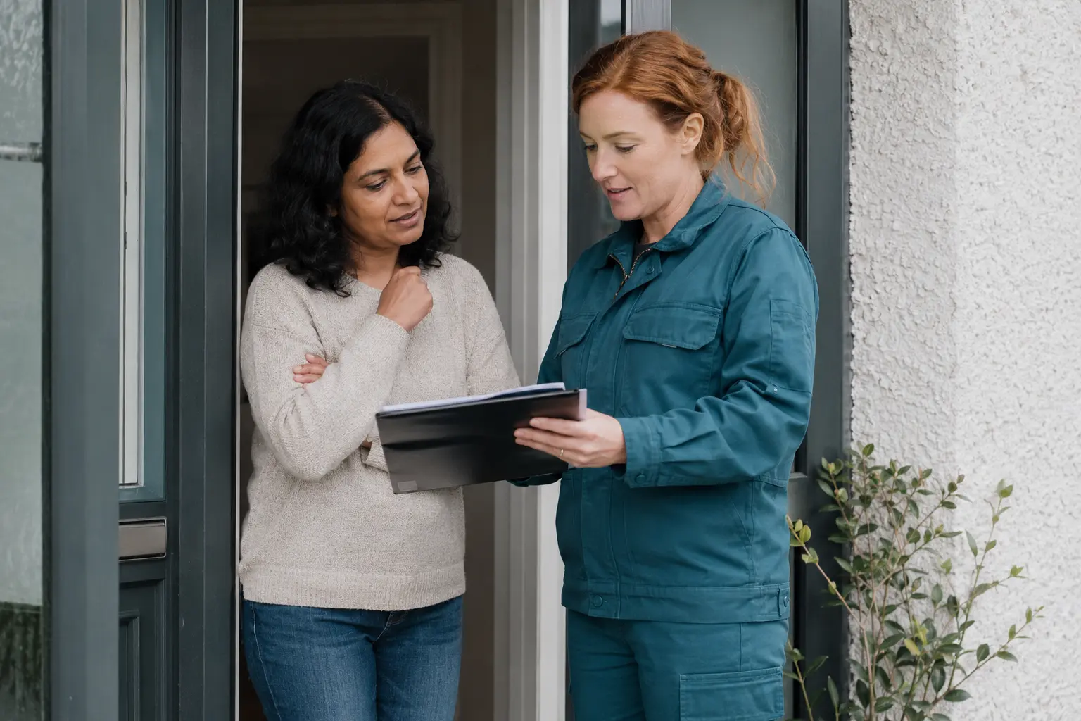 SEAI registered engineer answering a homeowner's questions at the front door of an Irish home