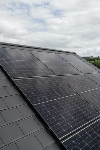 Solar panels fitted across a tiled roof under a cloudy sky, typical of the work SEAI registered installers in Sligo carry out